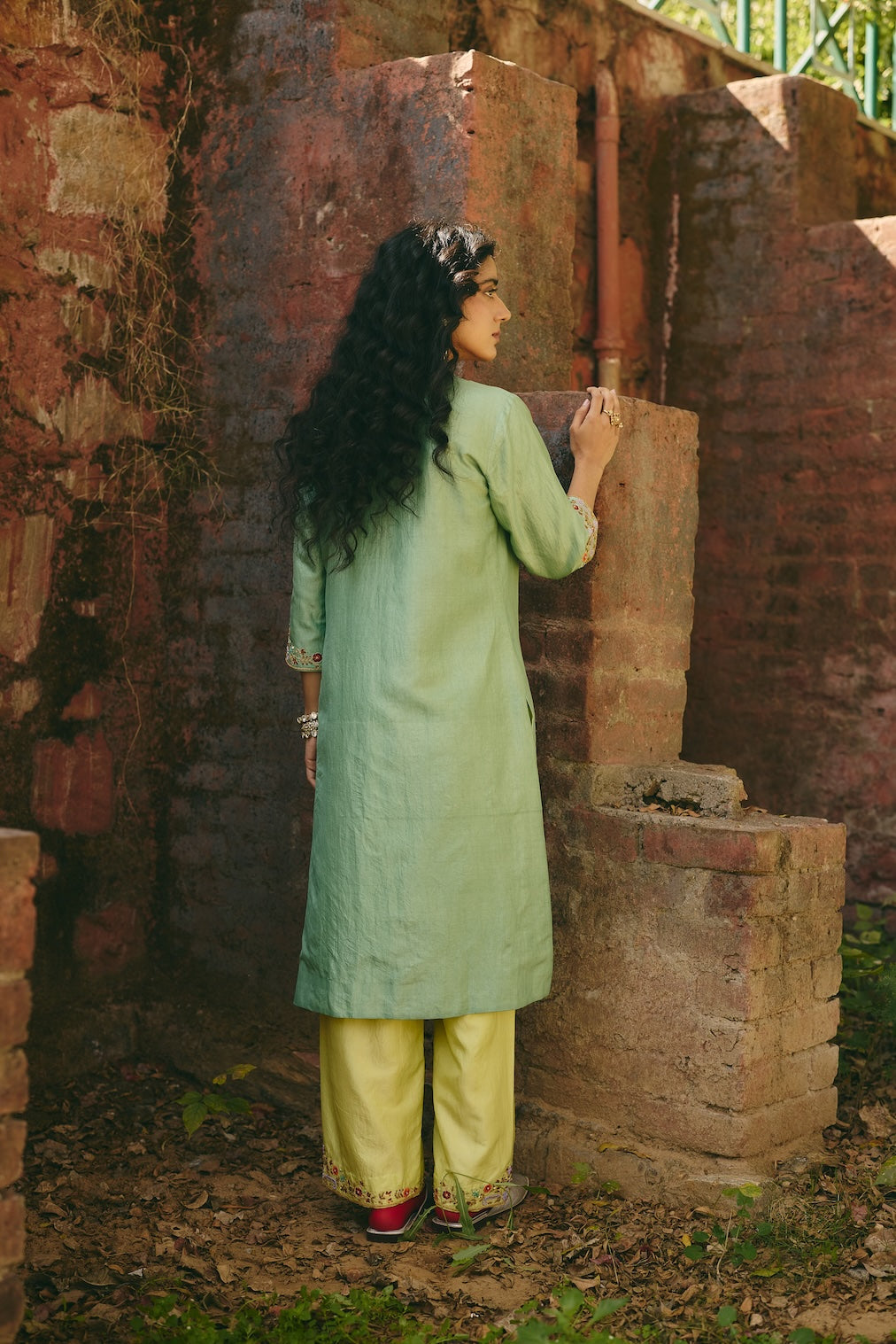 SAHIRA & FIZZA pistachio silk kurta set with floral motifs by Rashika Mittal - back view