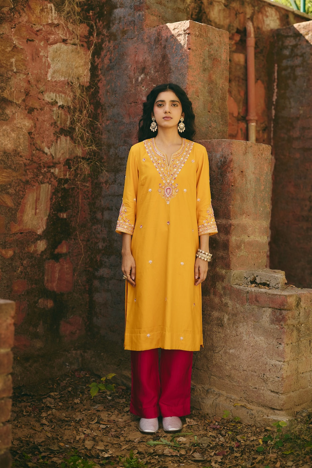SANA & RIA mustard satin kurta set with floral motifs by Rashika Mittal - front view