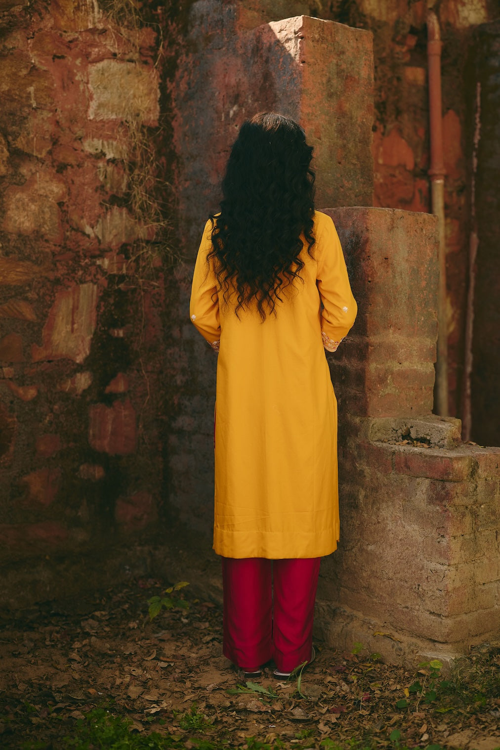 SANA & RIA mustard satin kurta set with floral motifs by Rashika Mittal - styled look