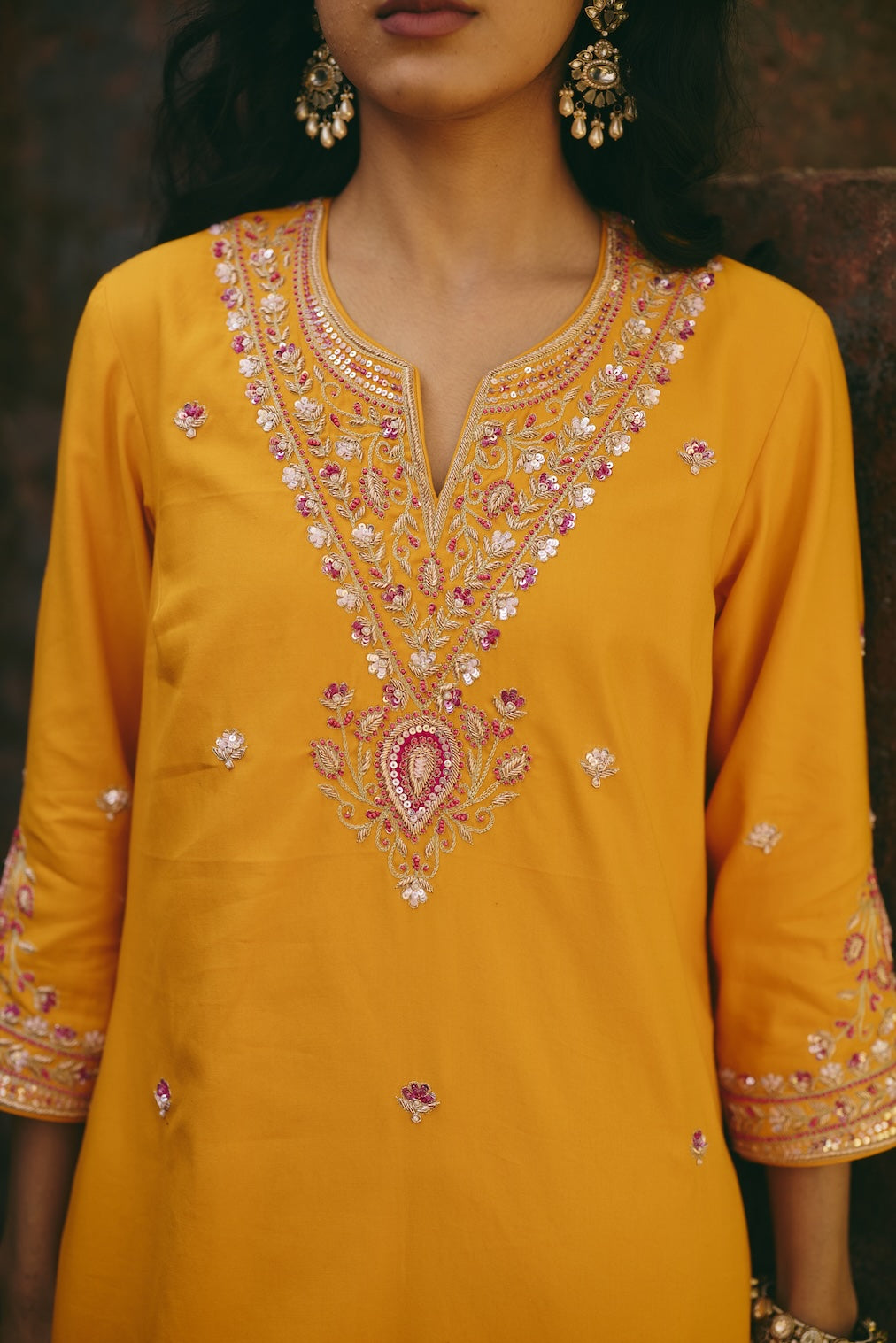 SANA & RIA mustard satin kurta set with floral motifs by Rashika Mittal - fabric detail