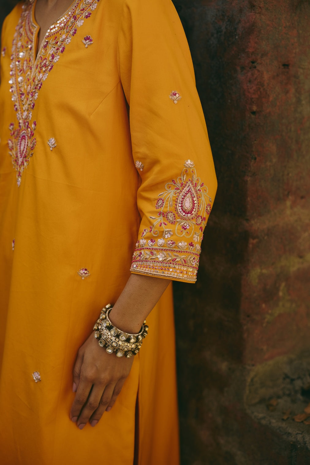SANA & RIA mustard satin kurta set with floral motifs by Rashika Mittal - full silhouette
