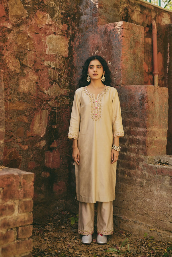OSHANI & VRITIKA champagne chanderi kurta set with botanical motifs by Rashika Mittal - front view