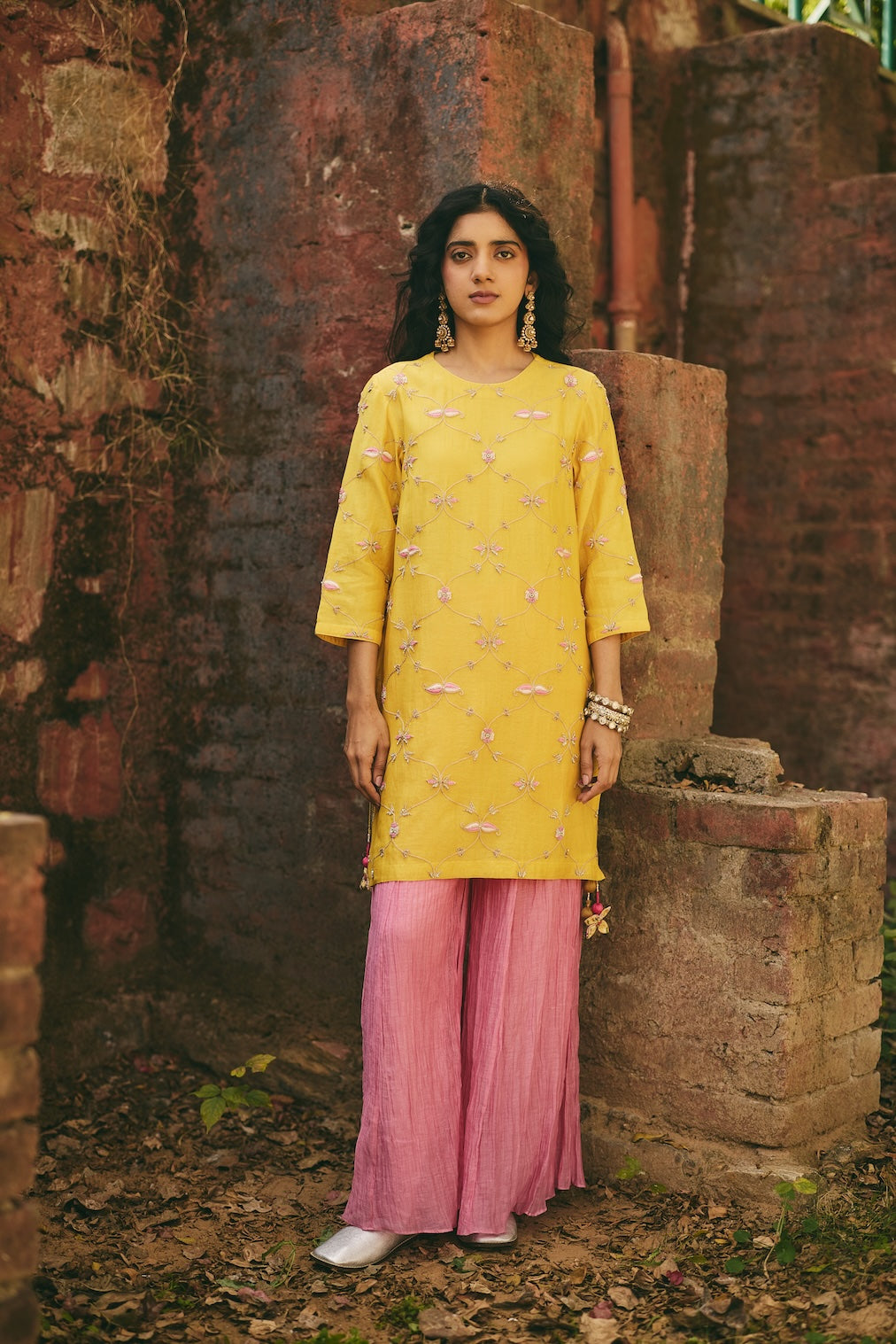 ROSHNI & NAZREEN mustard chanderi sharara set with trellis motifs by Rashika Mittal - front view