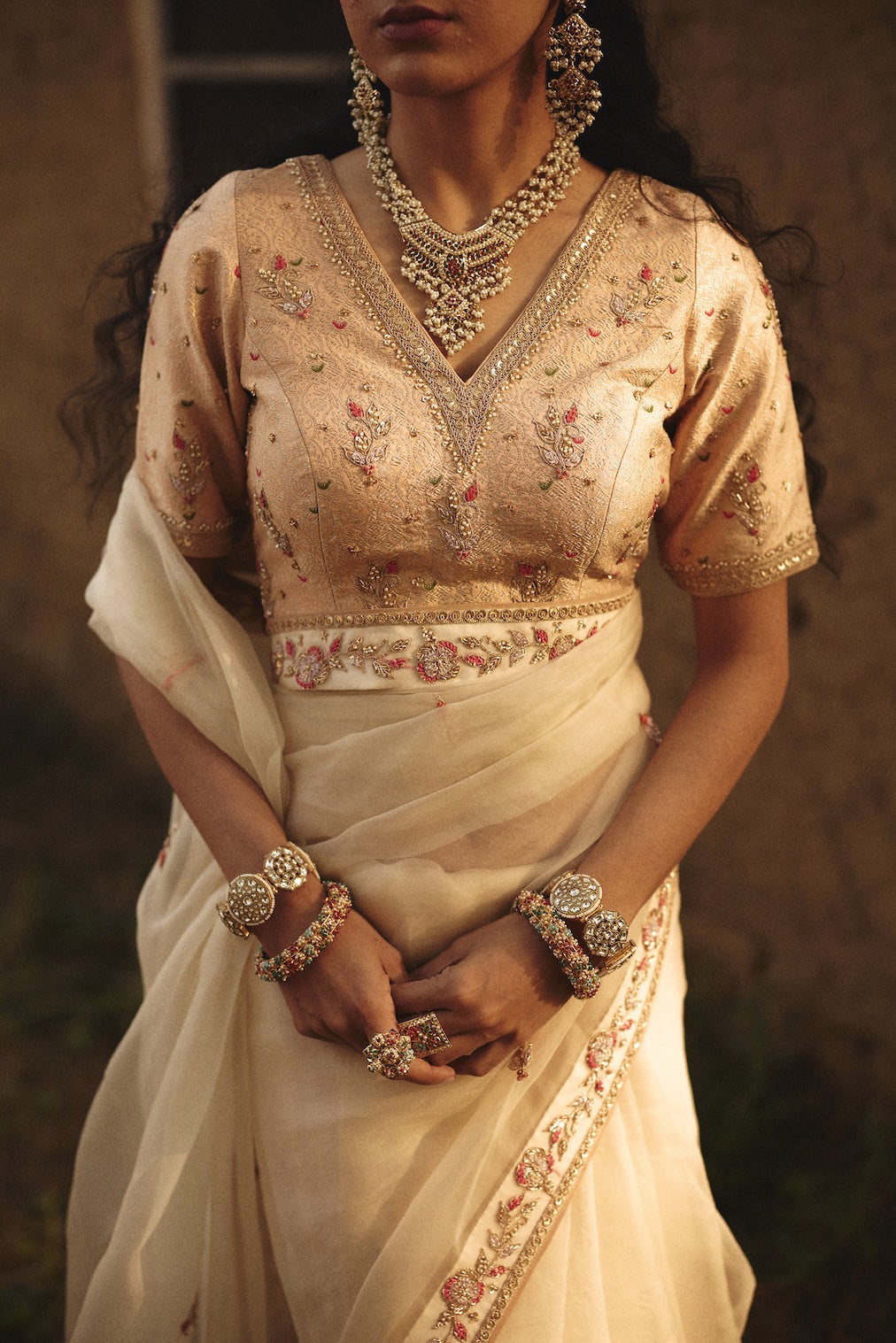 OJASVI champagne brocade saree with floral motifs by Rashika Mittal - front view