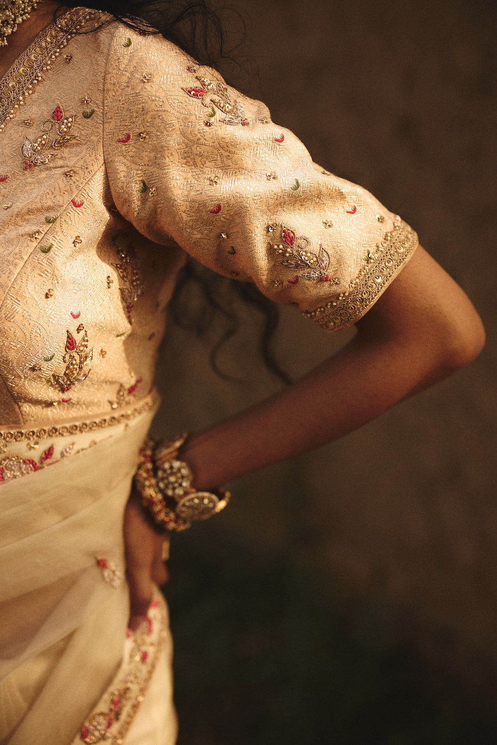 OJASVI champagne brocade saree with floral motifs by Rashika Mittal - back view