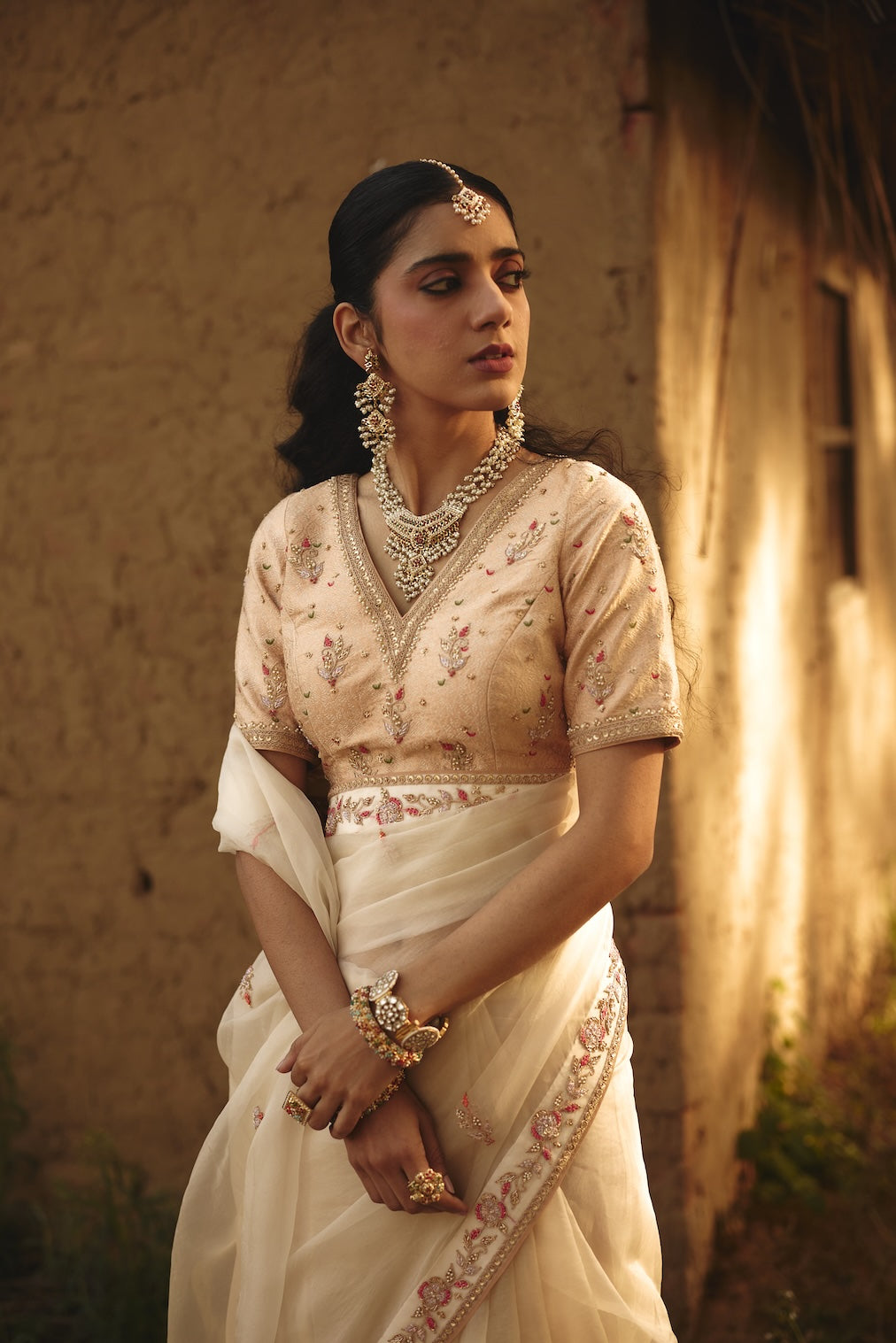 OJASVI champagne brocade saree with floral motifs by Rashika Mittal - styled look