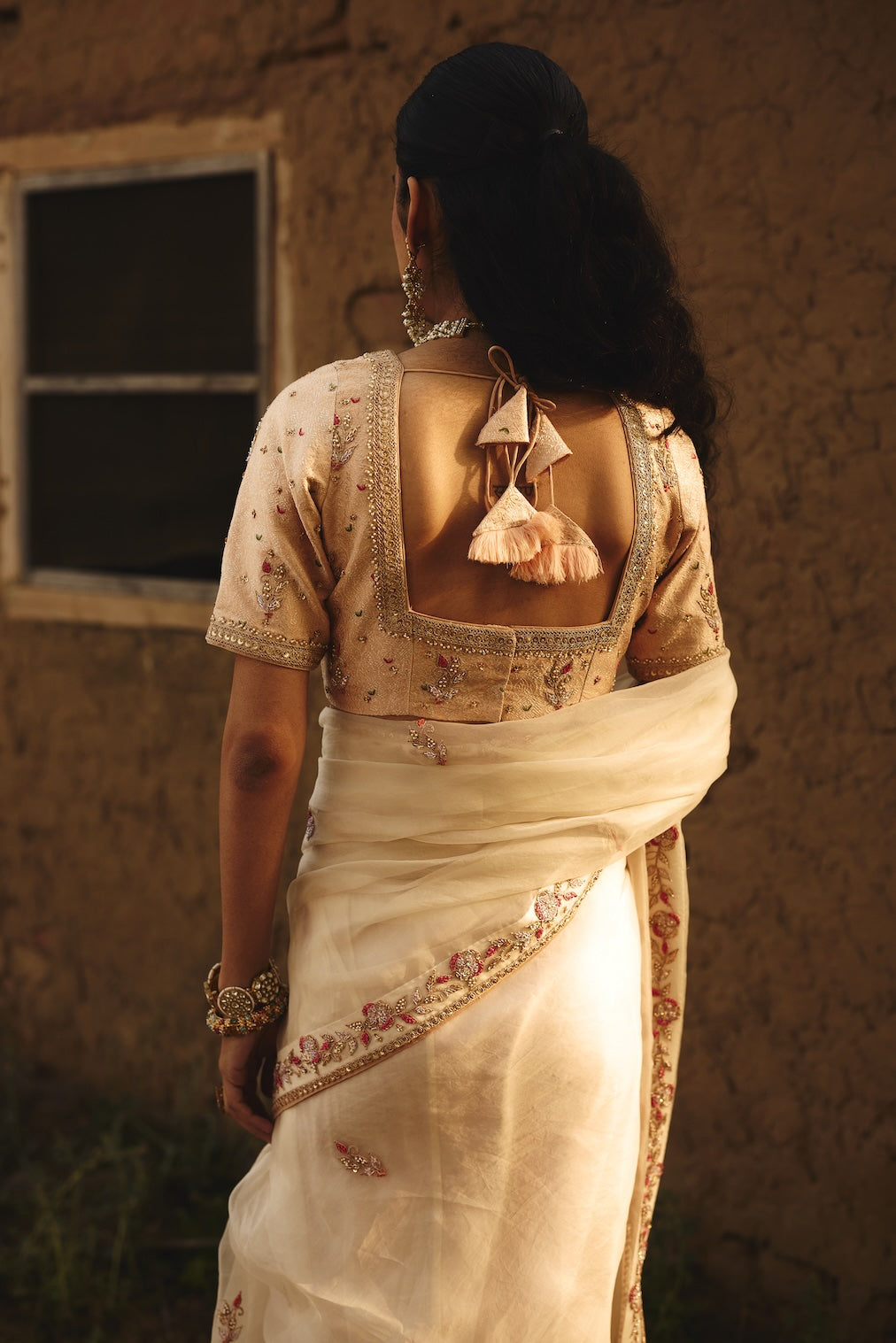 OJASVI champagne brocade saree with floral motifs by Rashika Mittal - close-up detail