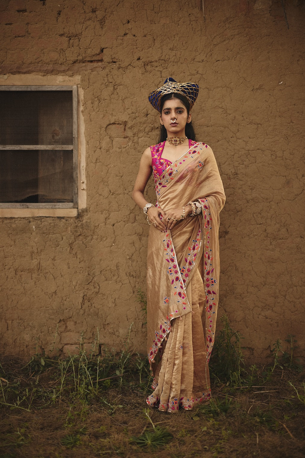 TARAANA gold tissue saree with floral motifs by Rashika Mittal - front view