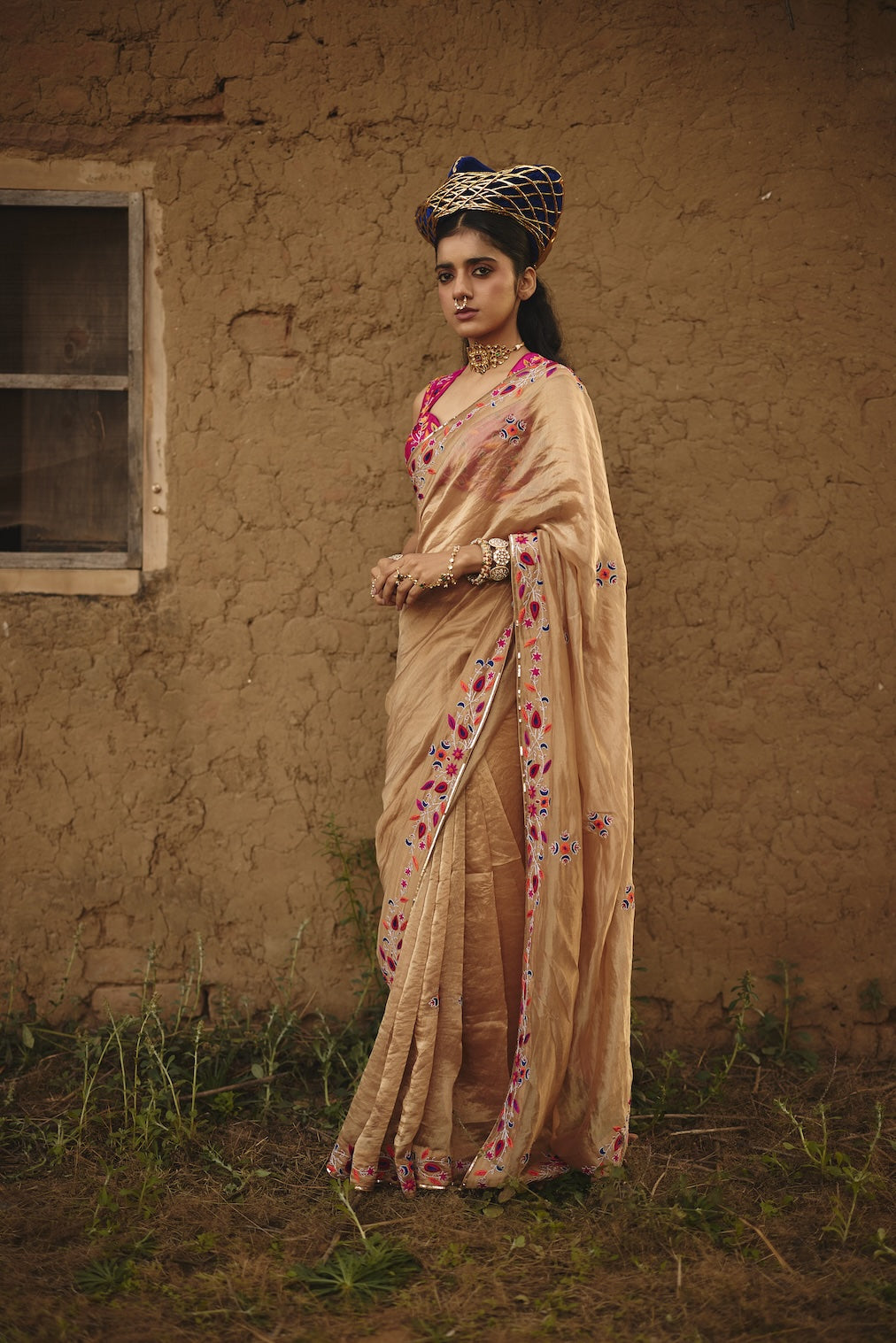 TARAANA gold tissue saree with floral motifs by Rashika Mittal - close-up detail