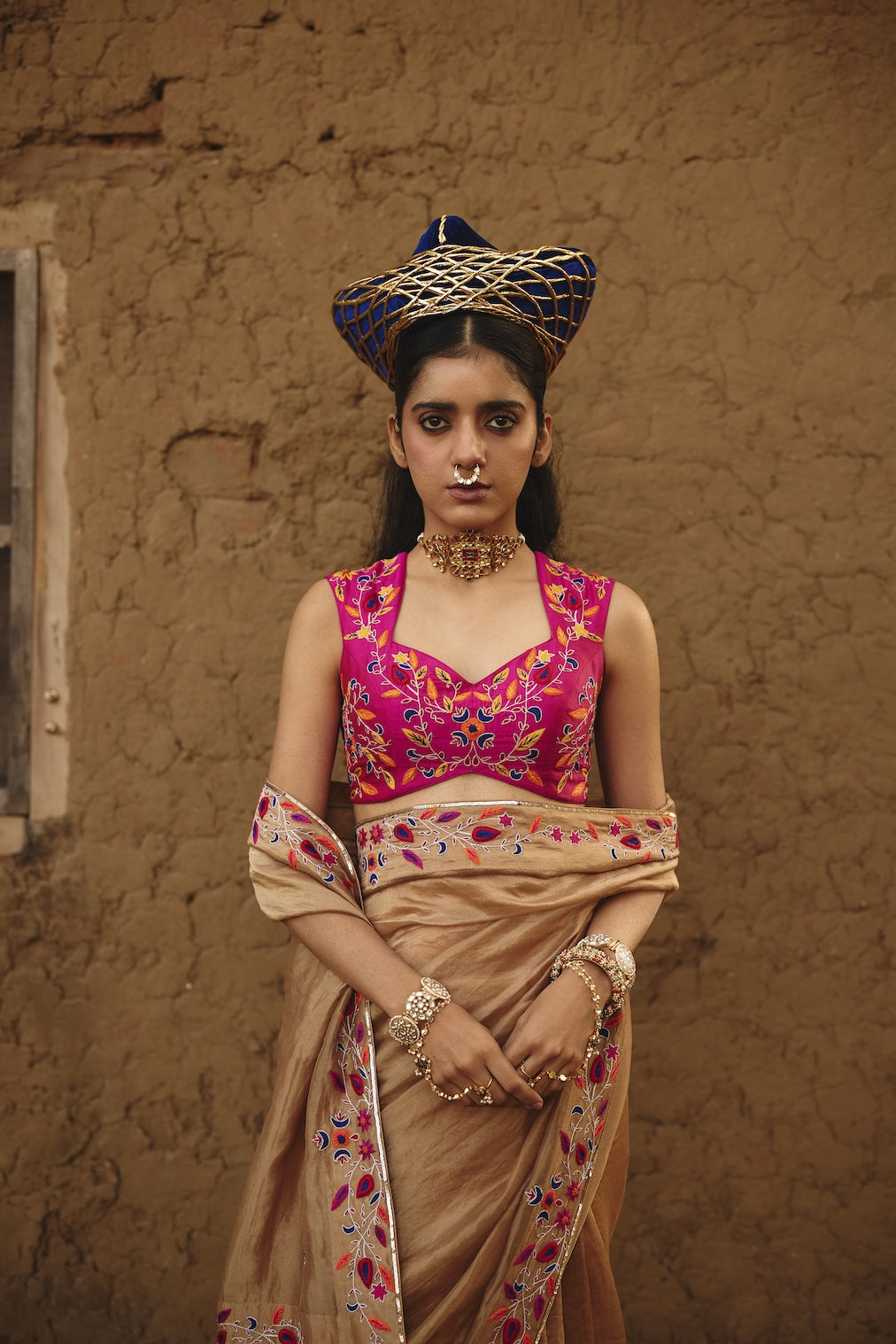 GULZAIB rani pink silk saree with floral motifs by Rashika Mittal - front view