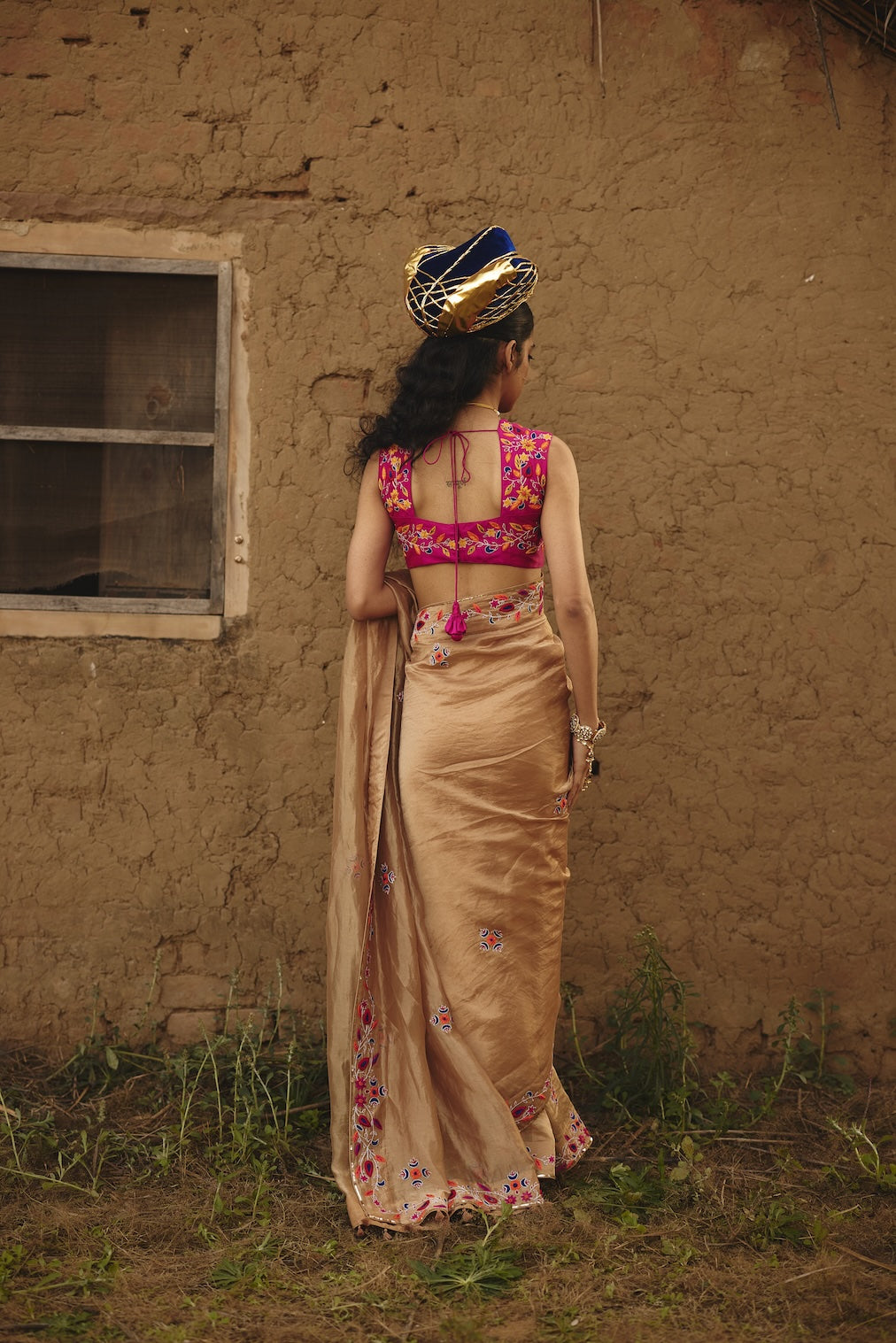 TARAANA gold tissue saree with floral motifs by Rashika Mittal - back view