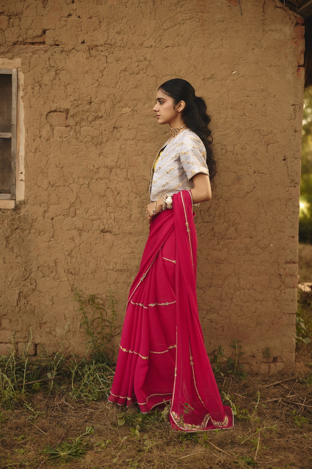 TEYA fuchsia chiffon saree with nature motifs by Rashika Mittal - back view