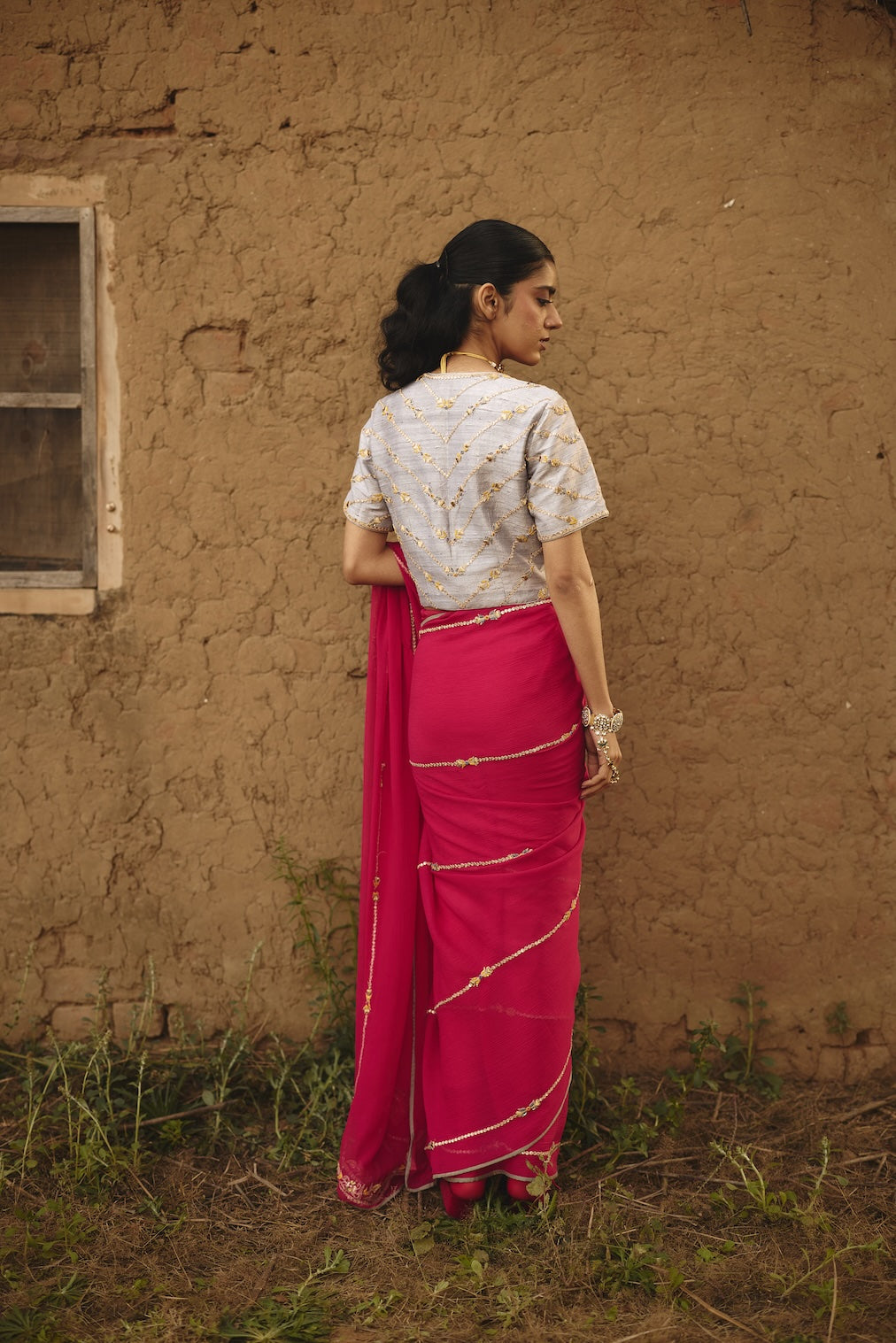 TEYA fuchsia chiffon saree with nature motifs by Rashika Mittal - styled look