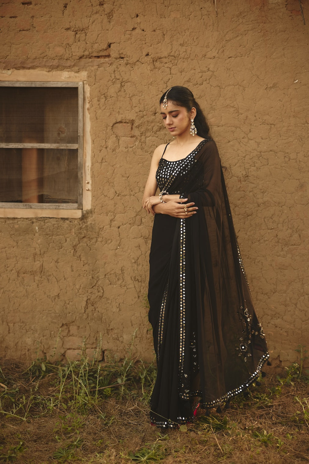 SARMAYA black chiffon saree with floral motifs by Rashika Mittal - back view