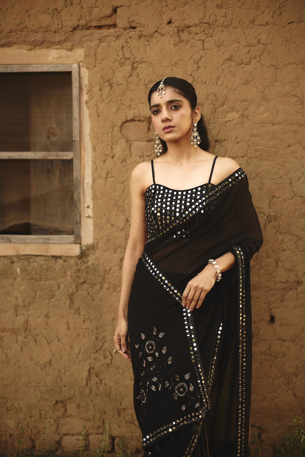 SHAFAQ black raw silk saree with geometric motifs by Rashika Mittal - back view