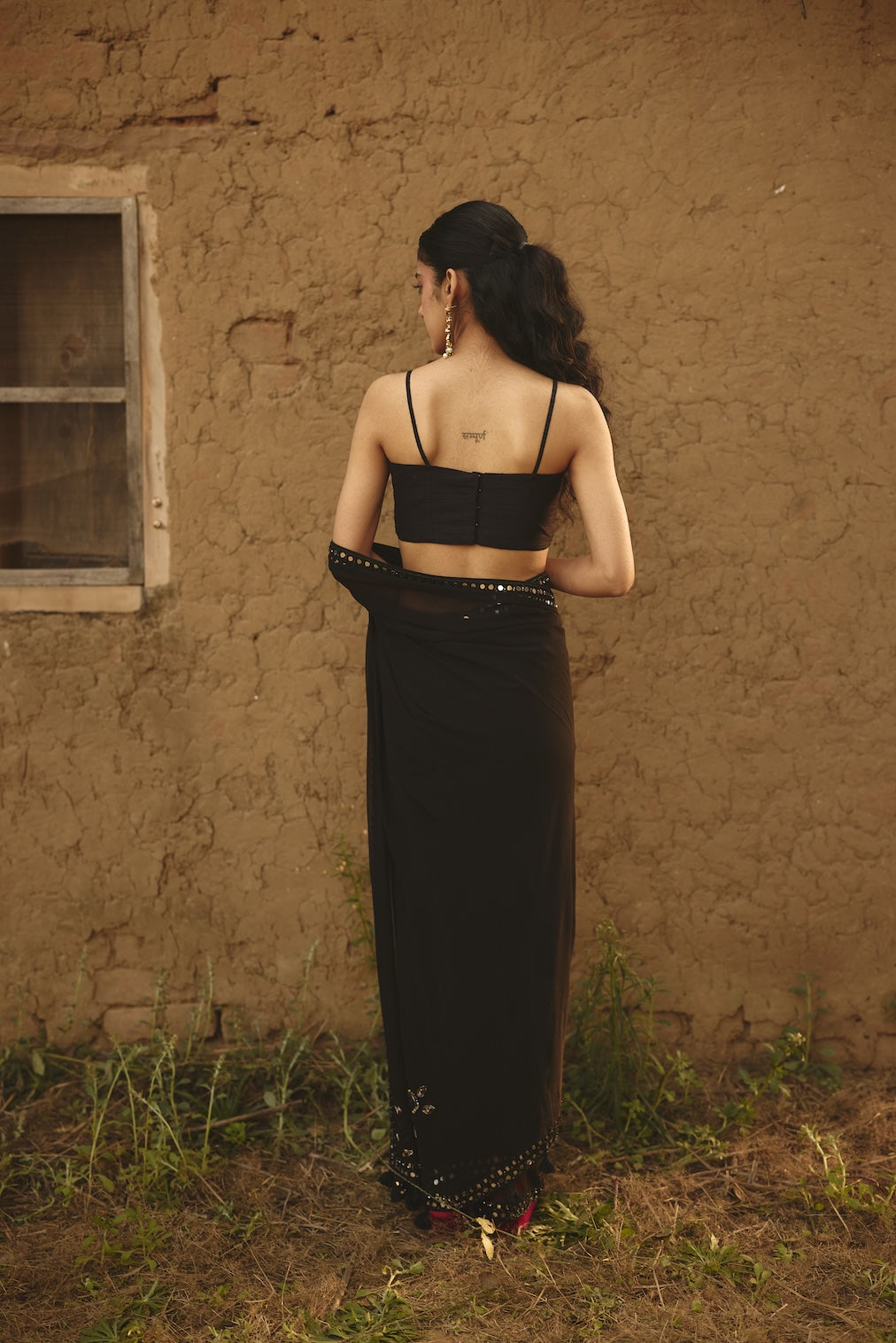 SHAFAQ black raw silk saree with geometric motifs by Rashika Mittal - close-up detail