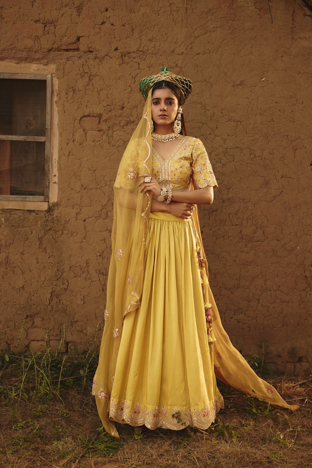 DRITI & HESYRA yellow silk lehenga with floral motifs by Rashika Mittal - front view