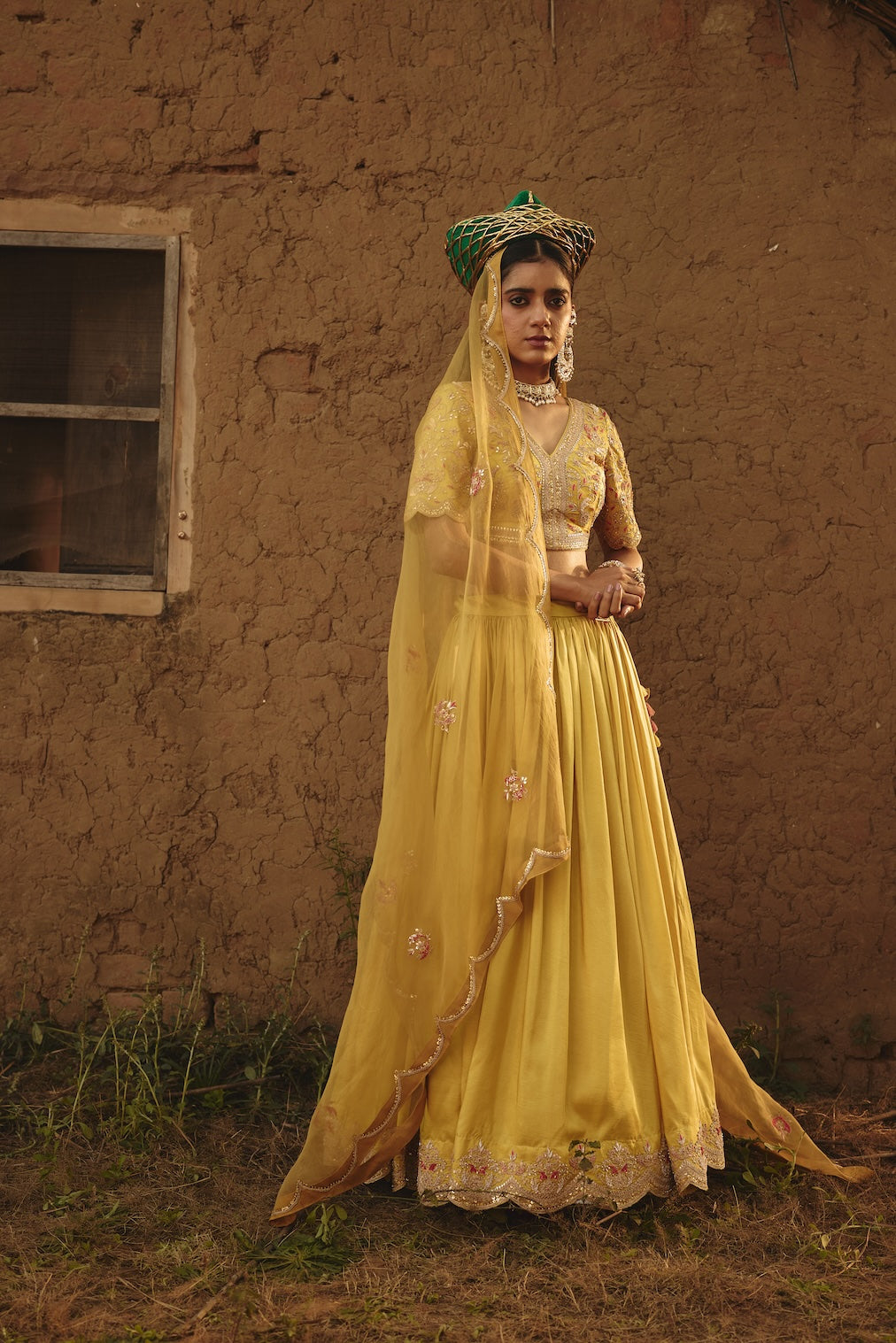 MIRAI yellow organza lehenga with floral motifs by Rashika Mittal - front view