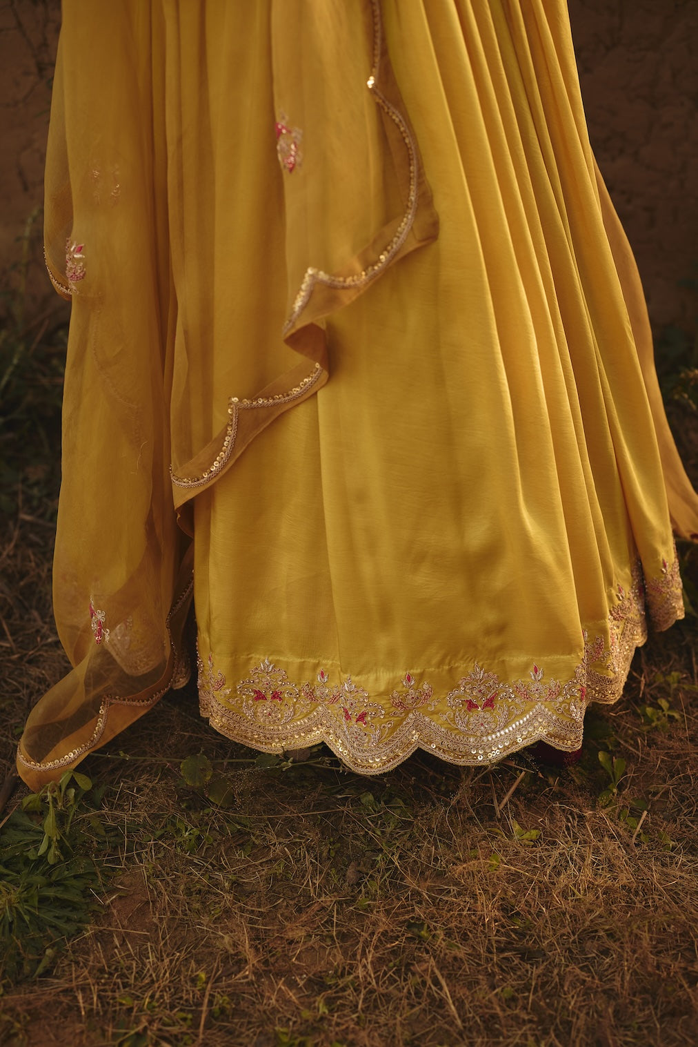 MIRAI yellow organza lehenga with floral motifs by Rashika Mittal - back view